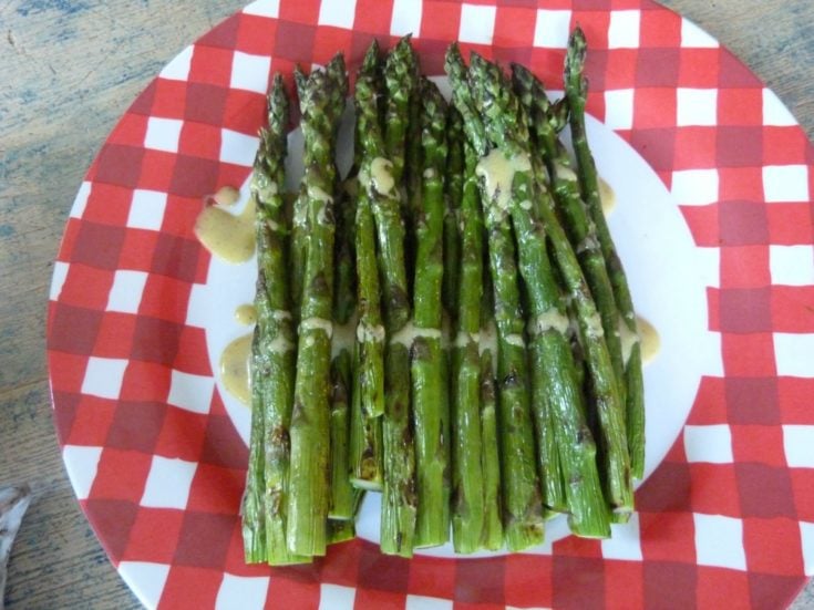 Grilled asparagus drizzled with mustard vinaigrette.