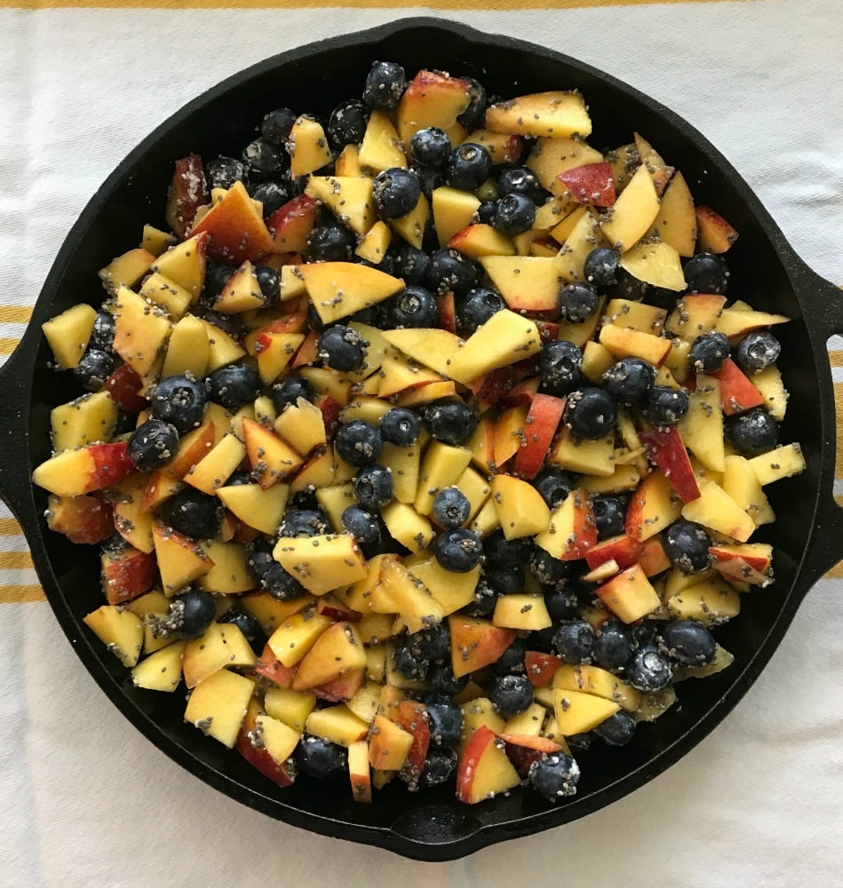 Cast Iron skillet loaded with nectarines, blueberries and chia seeds