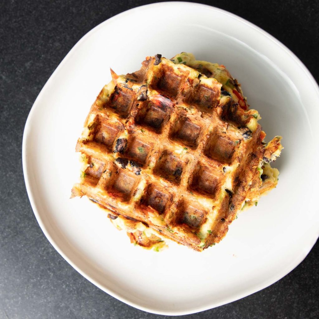 Crispy waffle with color flecks from veggies.