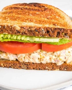 Vegan Tuna Salad on toasted bread with lettuce and tomato.