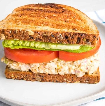 Vegan Tuna Salad on toasted bread with lettuce and tomato.
