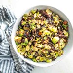 Crispy brussels sprouts with sundried tomatoes and chopped almonds.