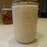 Mason jar filled with almond milk.