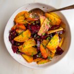 Wedges of whole roasted golden beets and red beets with balsamic, sea salt and chopped fresh parsley.