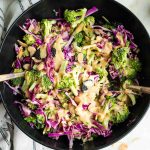 Chunks of raw broccoli and cabbage with a miso dressing, topped with scallions, almonds and dried cherries.