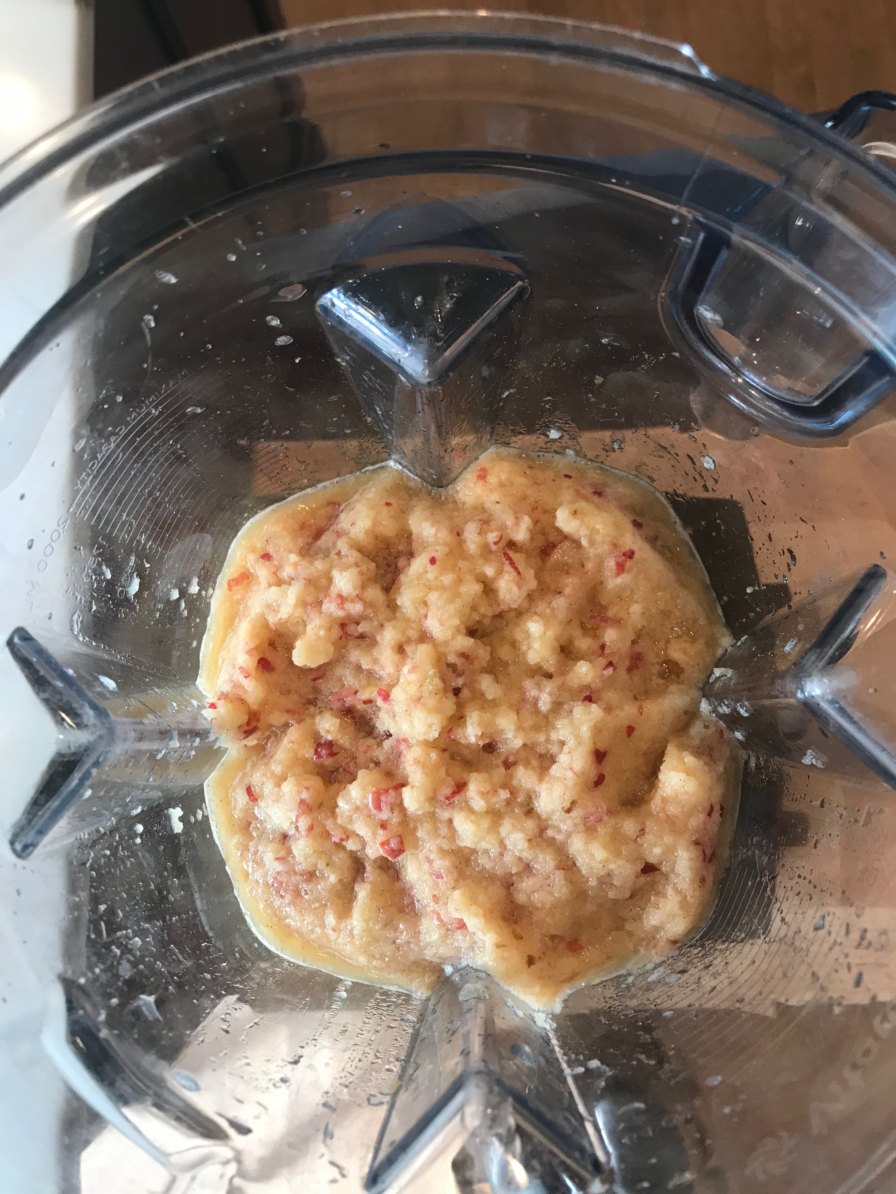 Raw apples blended inside a Vitamix, shown from the top view.