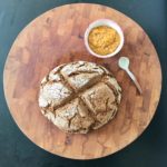 Gorgeous crusty loaf with a side of orange marmalade.