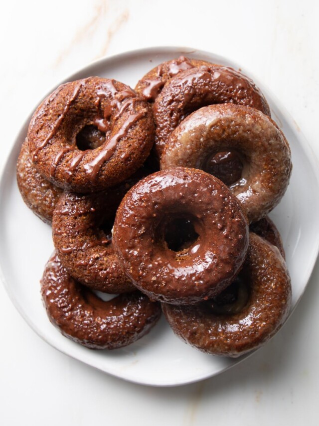A plate of glazed pumpkin donuts