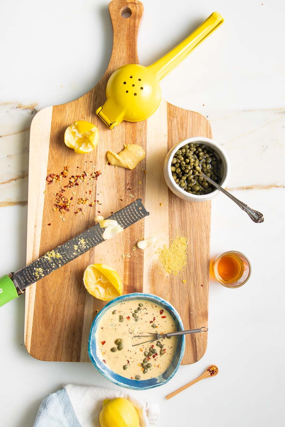 Ingredients for dressing: capers, lemon, garlic, crushed red pepper.