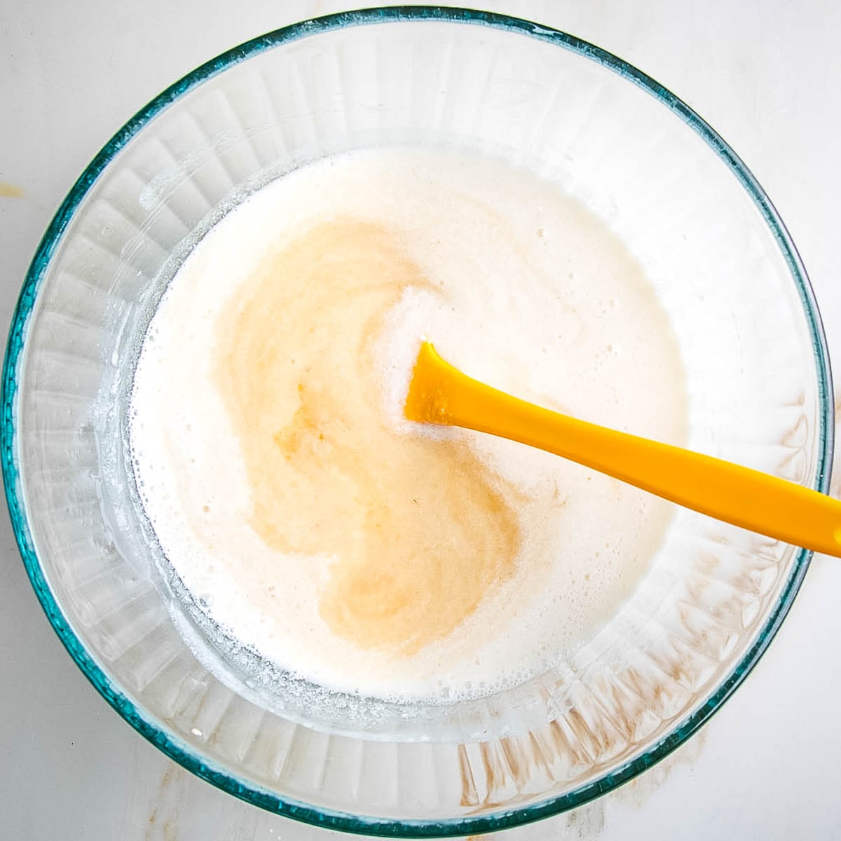 Mixing together wet ingredients for muffins. 