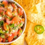 Fresh Tomatoes, Cilantro, Jalapenos and scallions chopped up for a homemade salsa, served with a side of corn chips.
