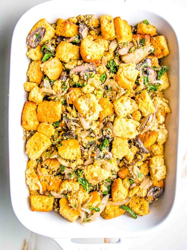 Cornbread cubes mixed with sauteed mushroom mixture including fresh herbs and onions.
