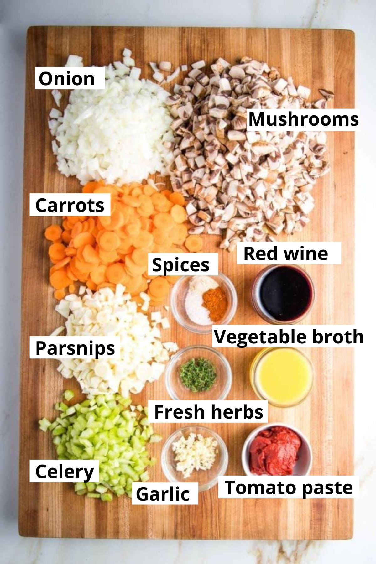 Labeled ingredients: onion, mushroom, carrots, parsnips, celery, vegetable broth, tomato paste, red wine, spices, garlic.