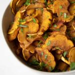 Delicata squash half moons, roasted with spices.