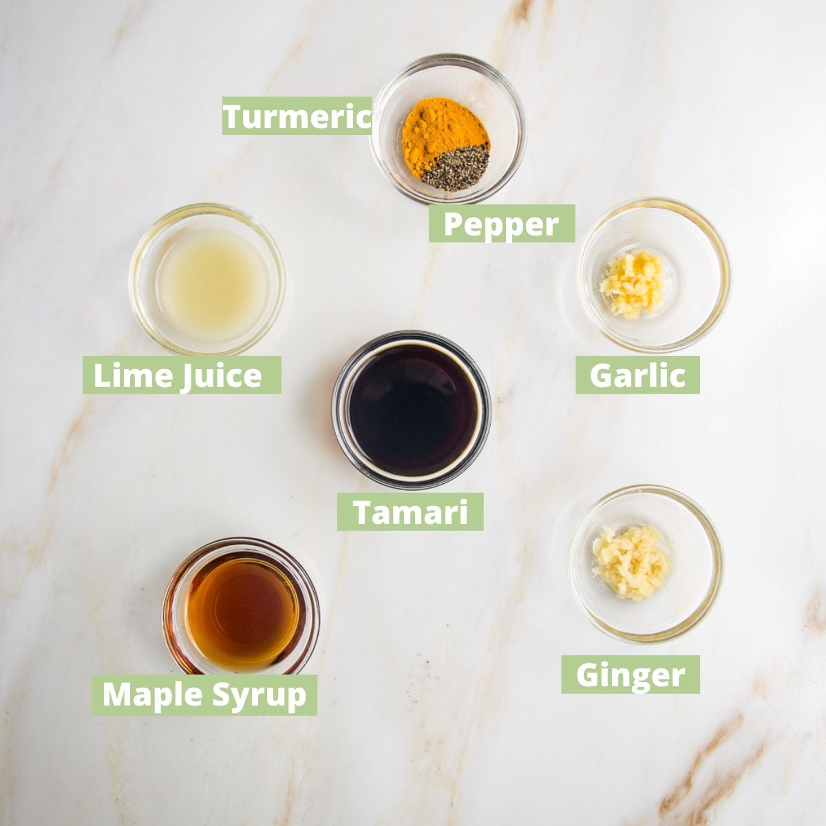 Tofu Satay Marinade ingredients labeled: turmeric, pepper, garlic, ginger, lime juice, tamari, maple syrup.