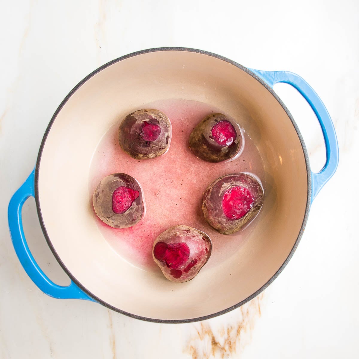 Whole beets in a Dutch oven with 1 inch of water, ready to roast. 
