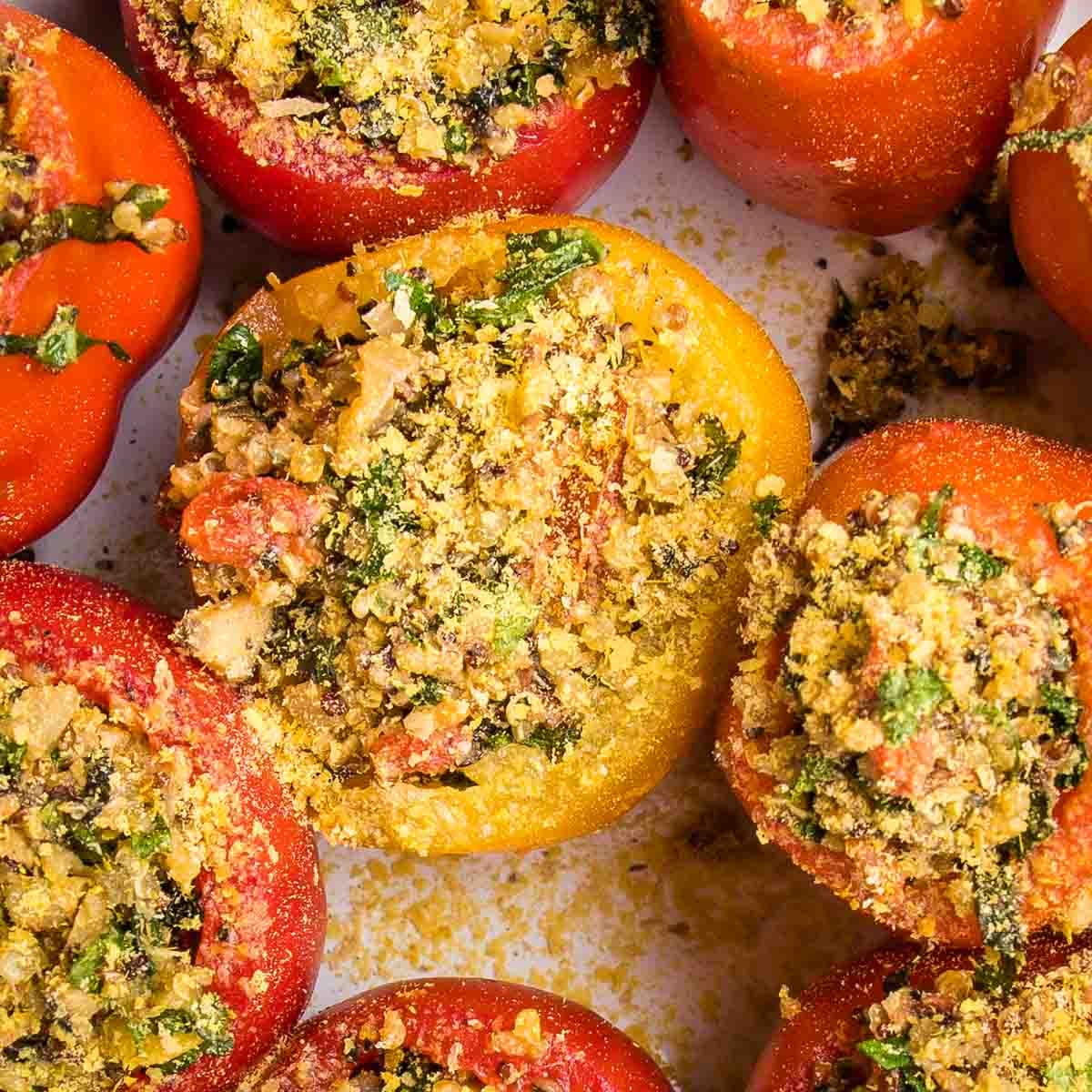 Large tomatoes, scooped out and filled with quinoa stuffing, then sprinkled with nutritional yeast.