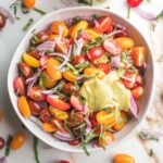 Chopped fresh tomatoes with red onion and fresh basil and a creamy balsamic vinaigrette.