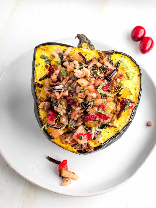 Acorn squash with wild rice stuffing and cranberries.