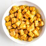 Cubes of crispy tofu, coated in a sticky orange glaze.