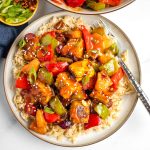 Crispy cubes of tofu plus pineapple, green peppers, onions and red peppers with sweet and sour sauce over rice.
