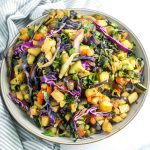 Chopped potatoes mixed in with colorful veggies like kale, red pepper, purple cabbage and zucchini for a colorful veggie hash.