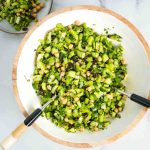 Chopped celery salad with raisins, chickpeas, shallot, cucumber, pistachios and fresh herbs.
