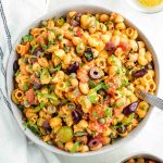 Pasta, white beans, olives and capers with tomatoes and fresh parsley.