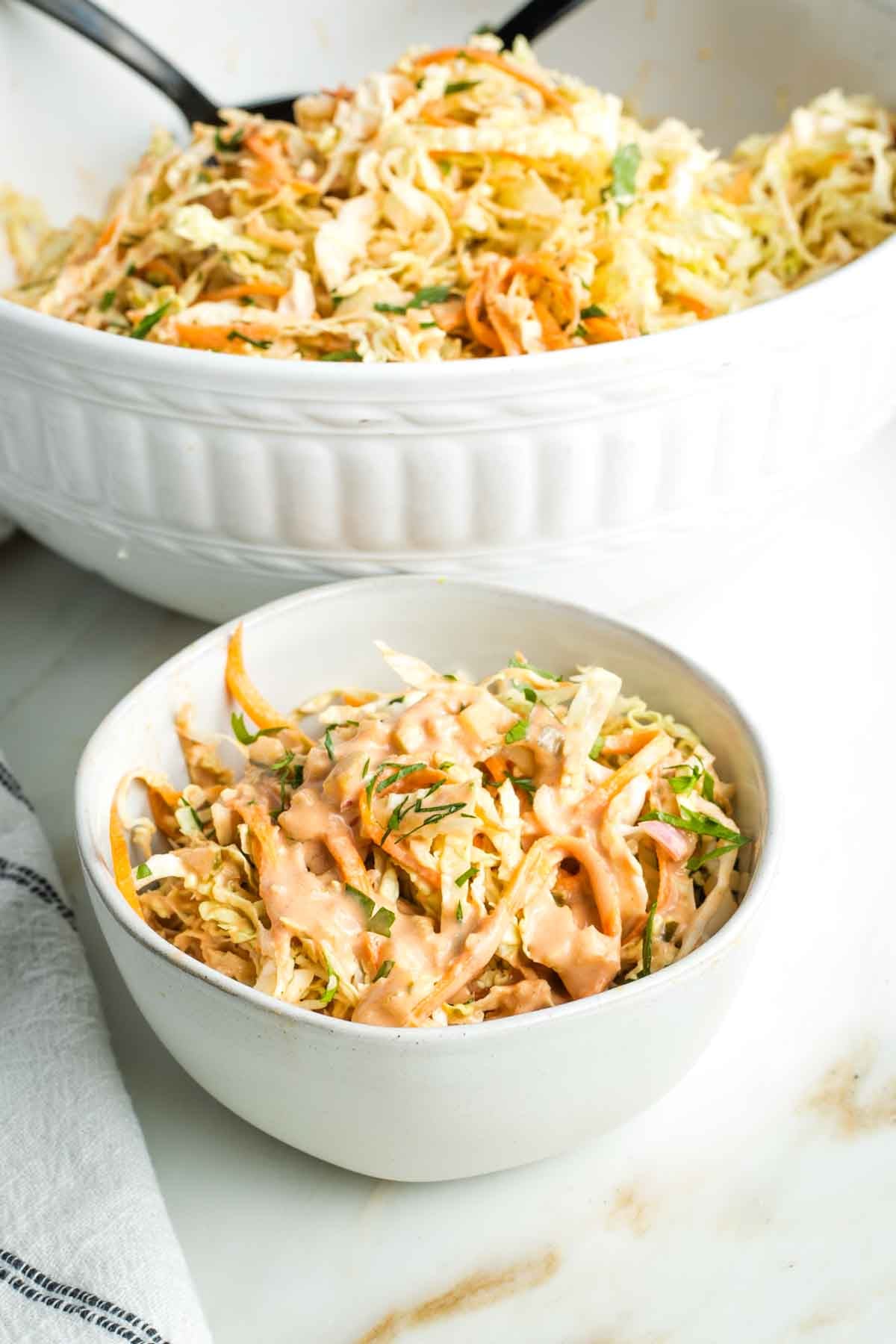 Creamy Russian dressing on top of a simple coleslaw.