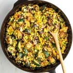 Skillet with zucchini, mushrooms, corn and edamame.