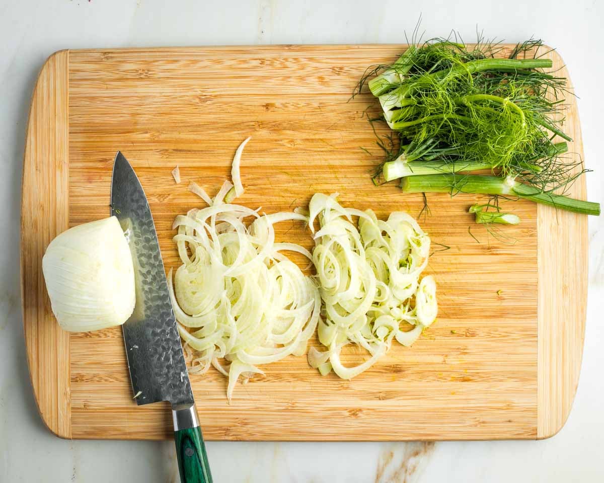 Fronds cut off the top of a fennel bulb and then it's cut super thin across the middle.