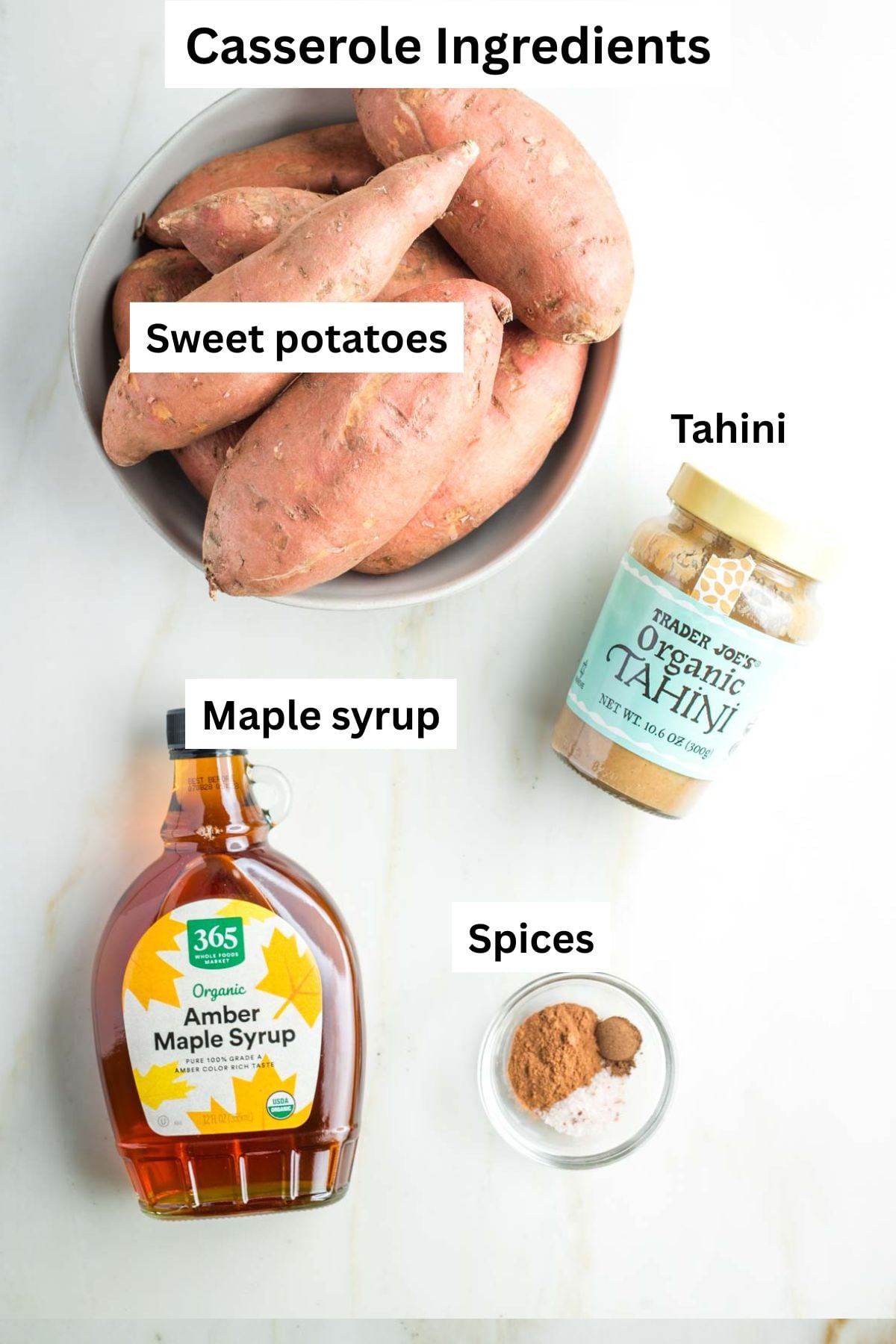 Labeled sweet potato casserole ingredients: whole sweet potatoes in a bowl, tahini, maple syrup and spices. 