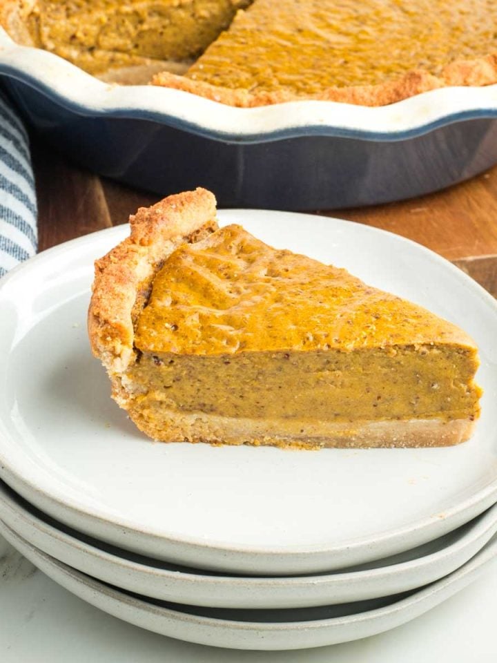 Side view of a perfect slice of pumpkin pie.