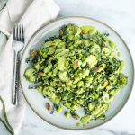 Kale, cucumber, edamame and parsley salad sprinkled with pistachios and drizzled with creamy pistachio dressing.