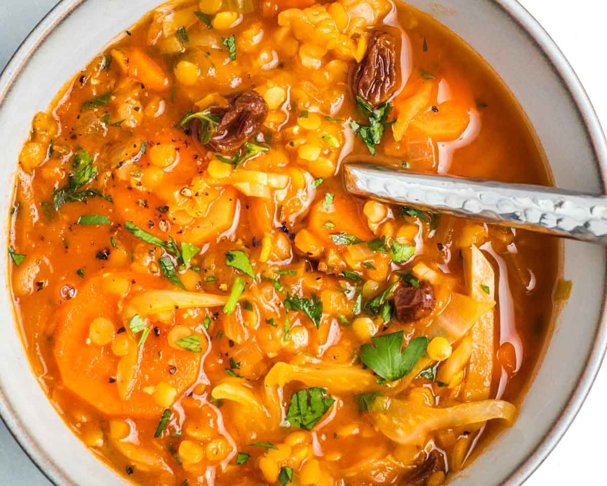 Brothy tomato soup base with cabbage, raisins, carrots, lentils and sprinkled with fresh parsley.