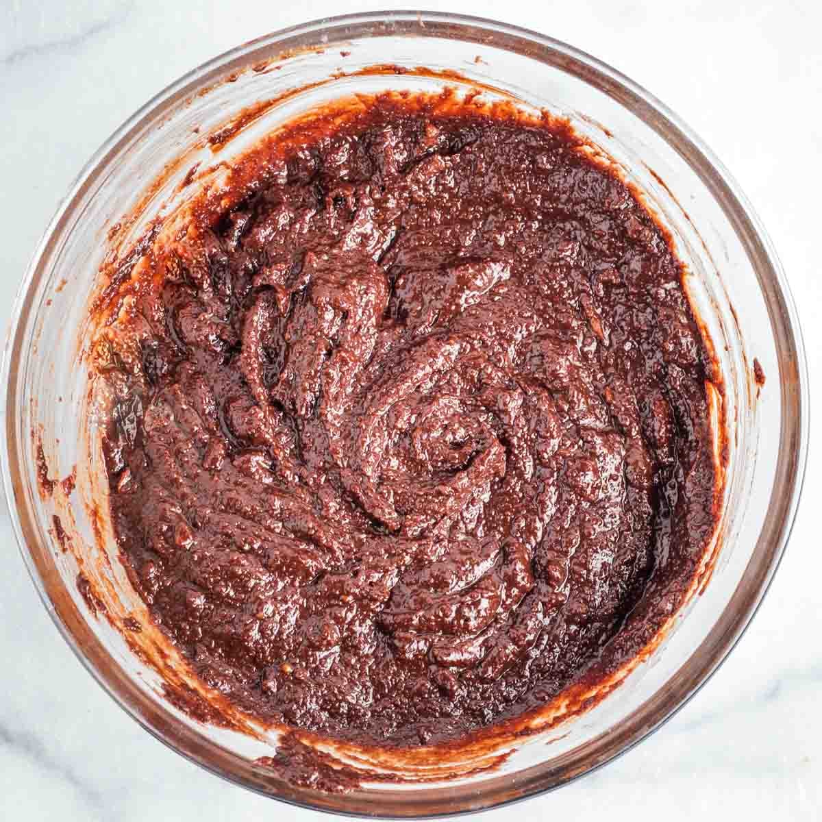Bowl full of chocolate cake batter.