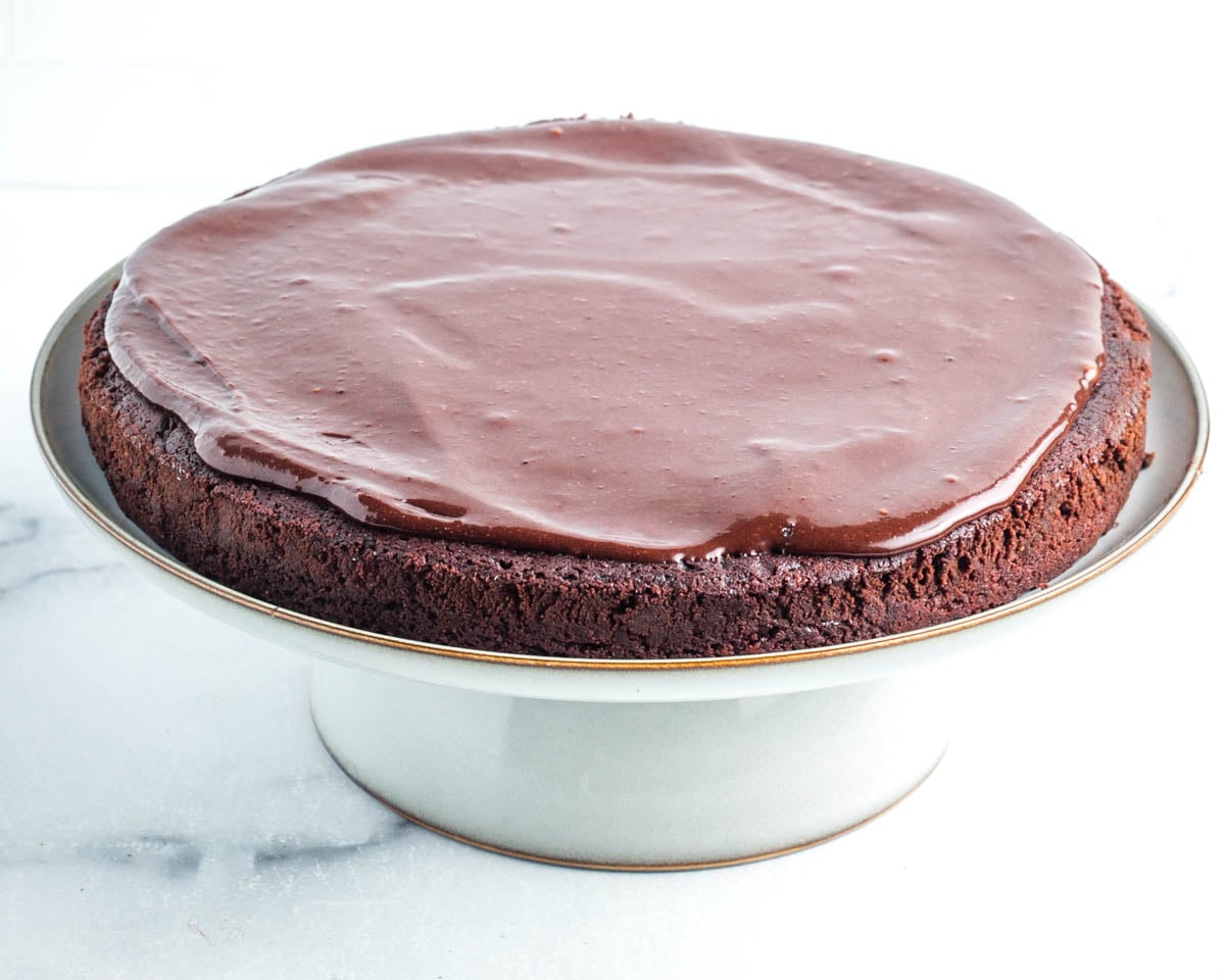 Chocolate frosting on top of a chocolate cake.