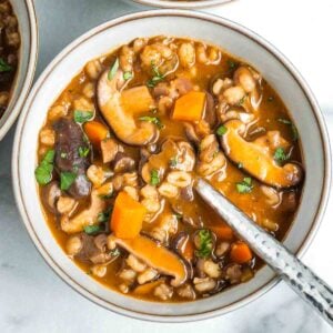 Rich tomato broth with mushrooms, barley, carrots and sprinkled with fresh herbs.