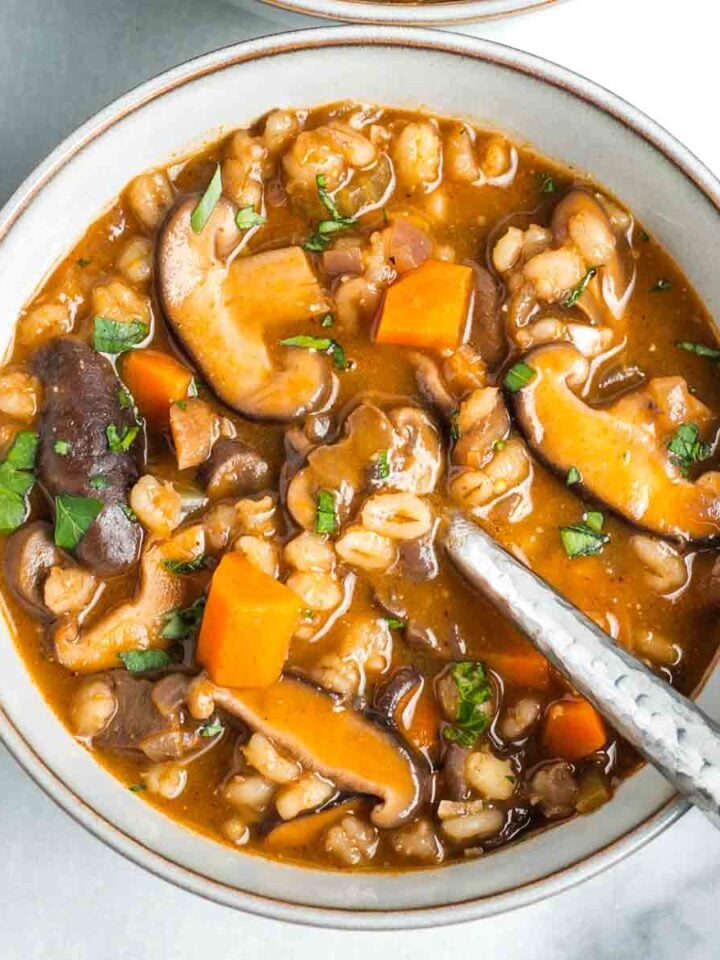 Rich tomato broth with mushrooms, barley, carrots and sprinkled with fresh herbs.