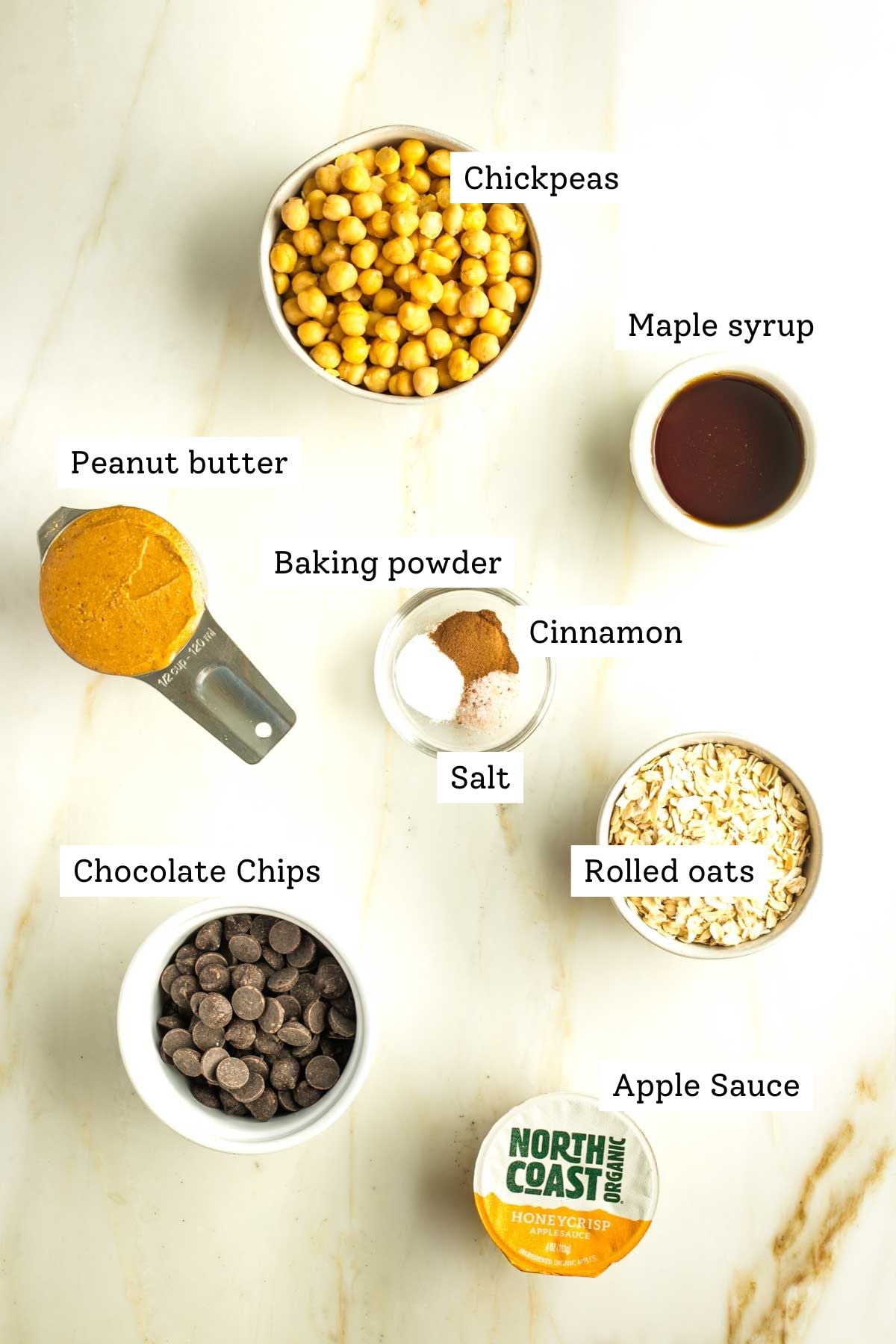 Labeled ingredients: chickpeas, peanut butter, maple syrup, chocolate chips, oats, applesauce. 