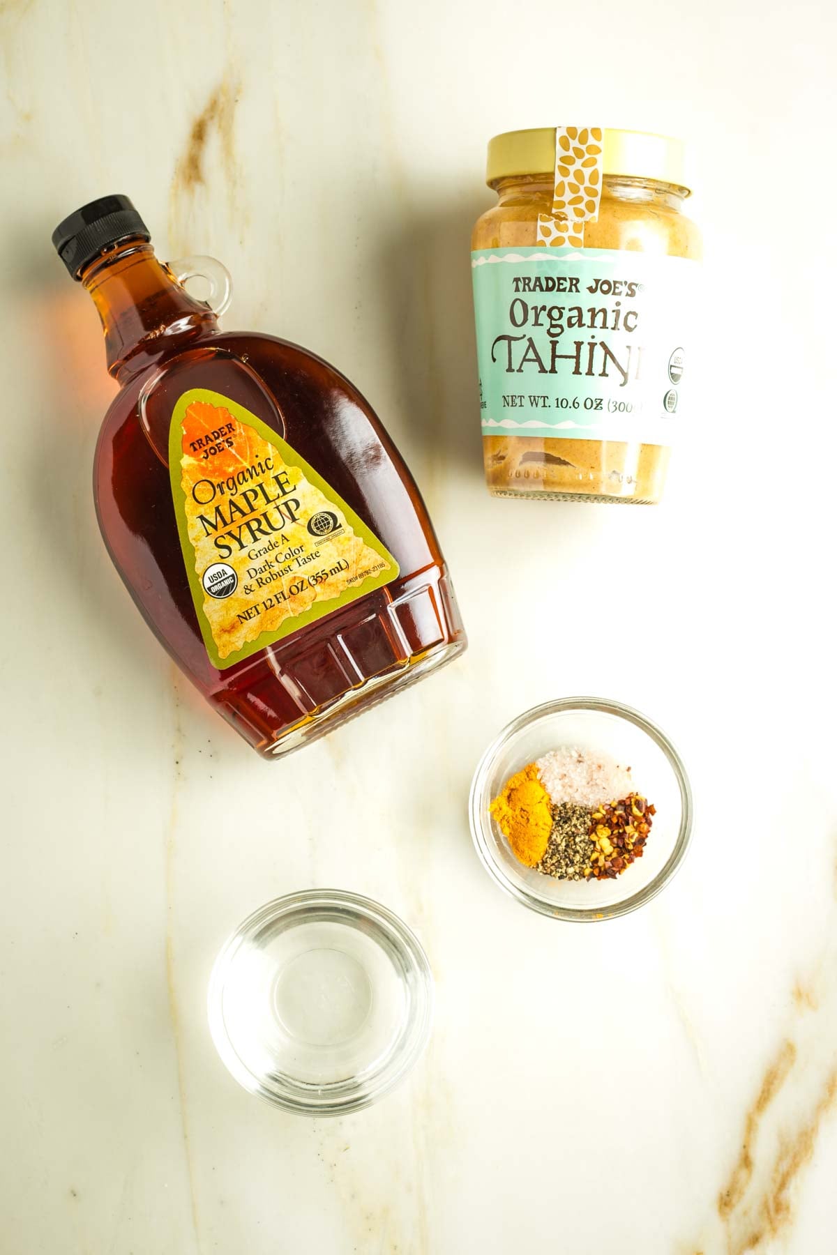 Ingredients for maple tahini drizzle: maple syrup, tahini, spices, water. 
