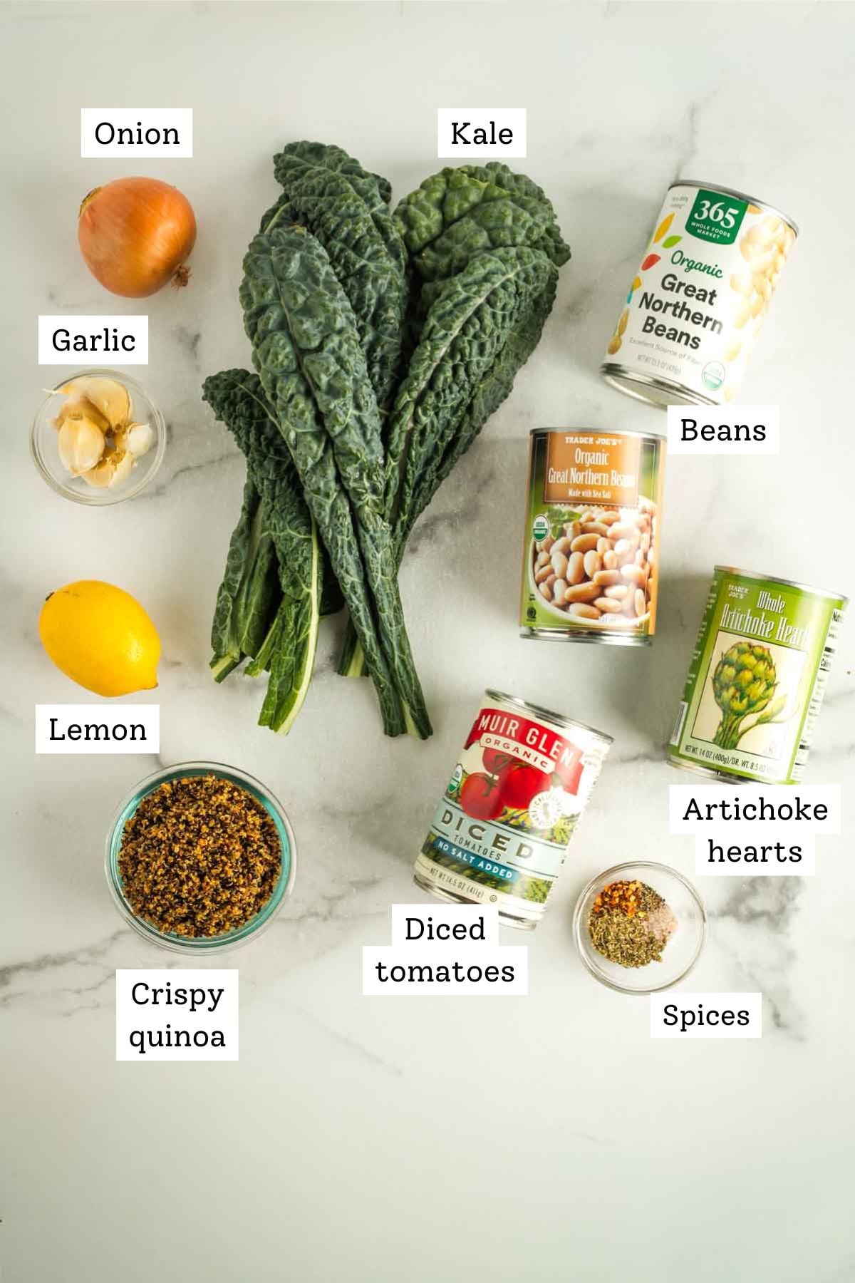 Labeled ingredients for a white bean, tomato and kale skillet with crispy quinoa. 