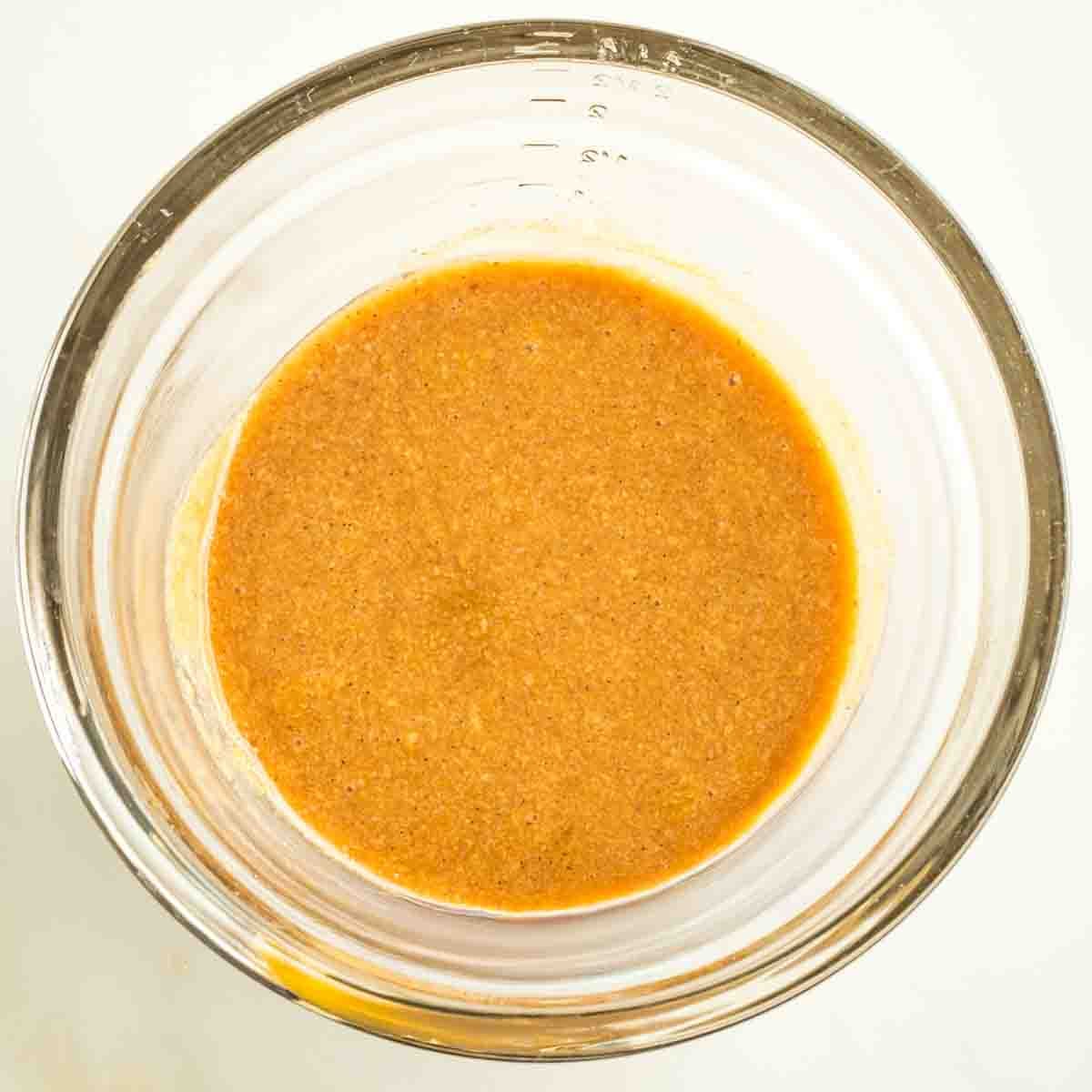 Maple tahini caramel in a small glass bowl. 